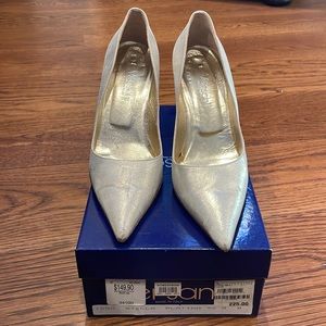 Versani (made in Italy) pointed toe heels in a brushed gold color.